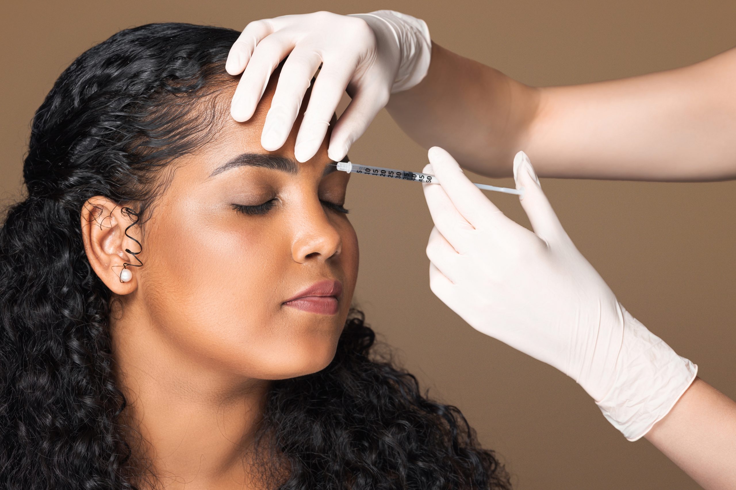 woman gets botox between eyebrows