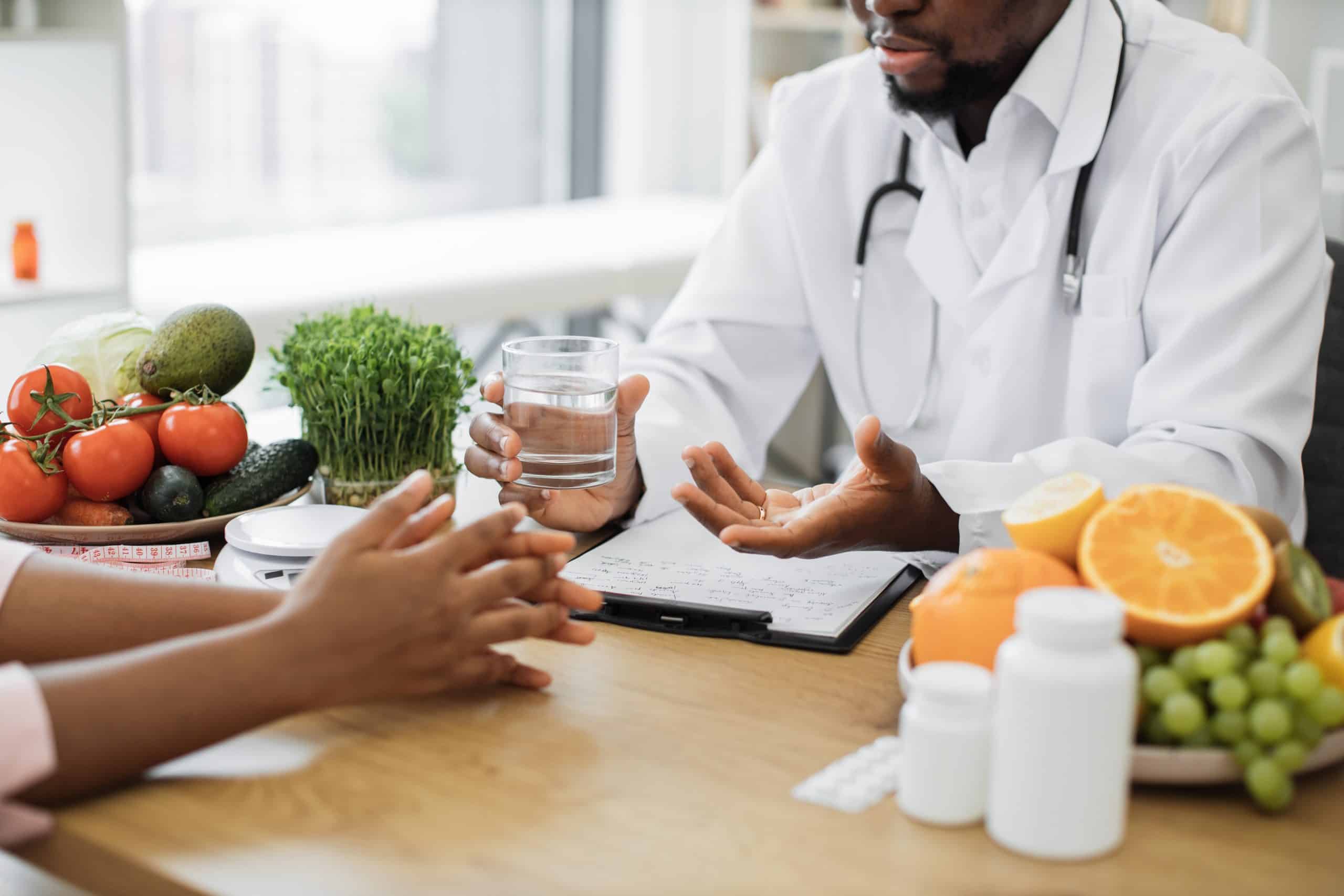 doctor sitting across from a patient in a consult