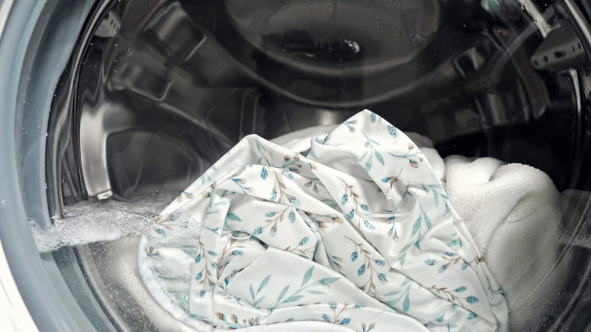 white clothes washing in a washing machine