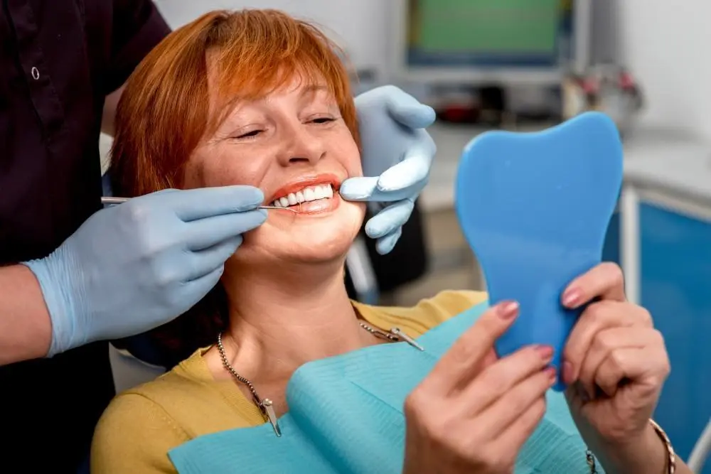 Dentist discussing candidacy for dentures with a patient