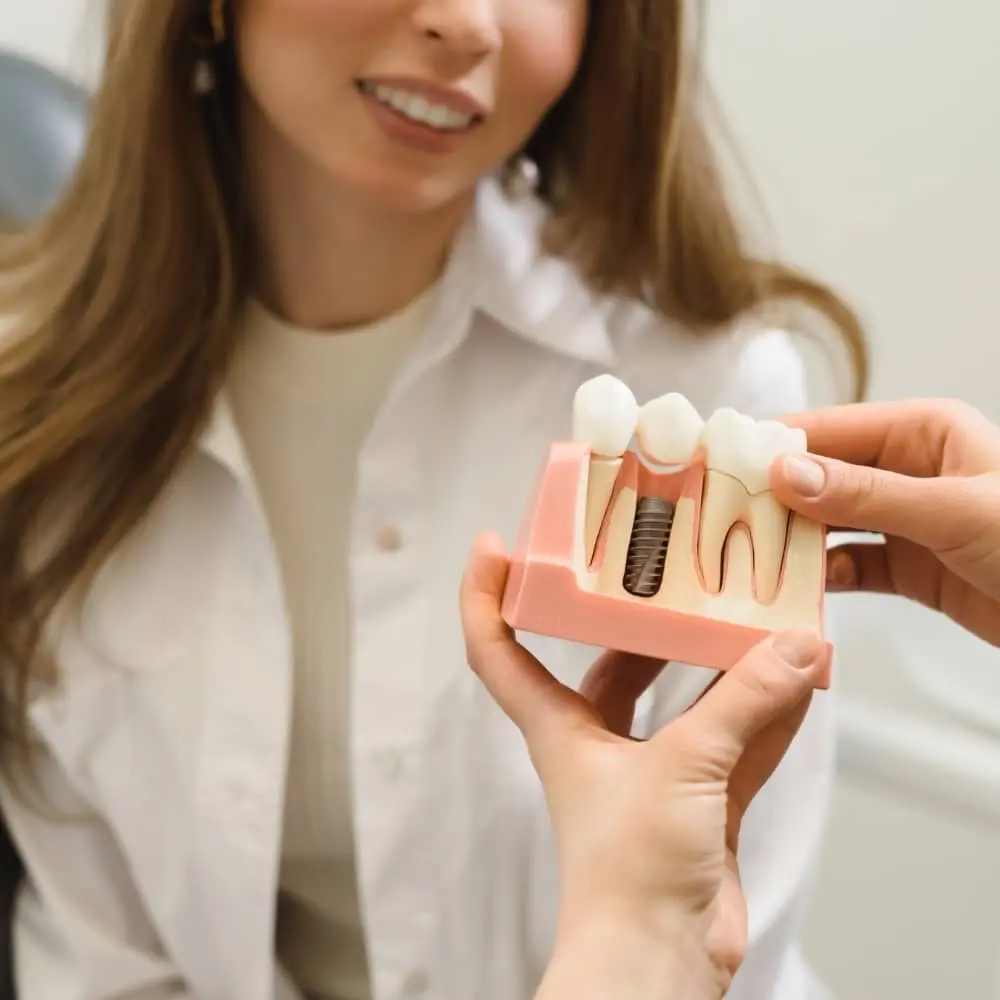 Patient discussing dental implant treatment with a Stonebriar dentist