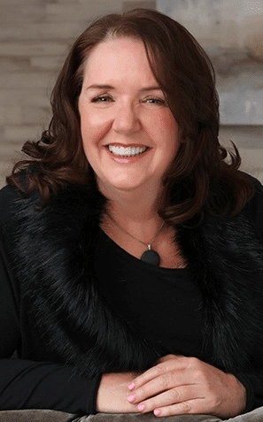 Portrait of Kathy smiling confidently