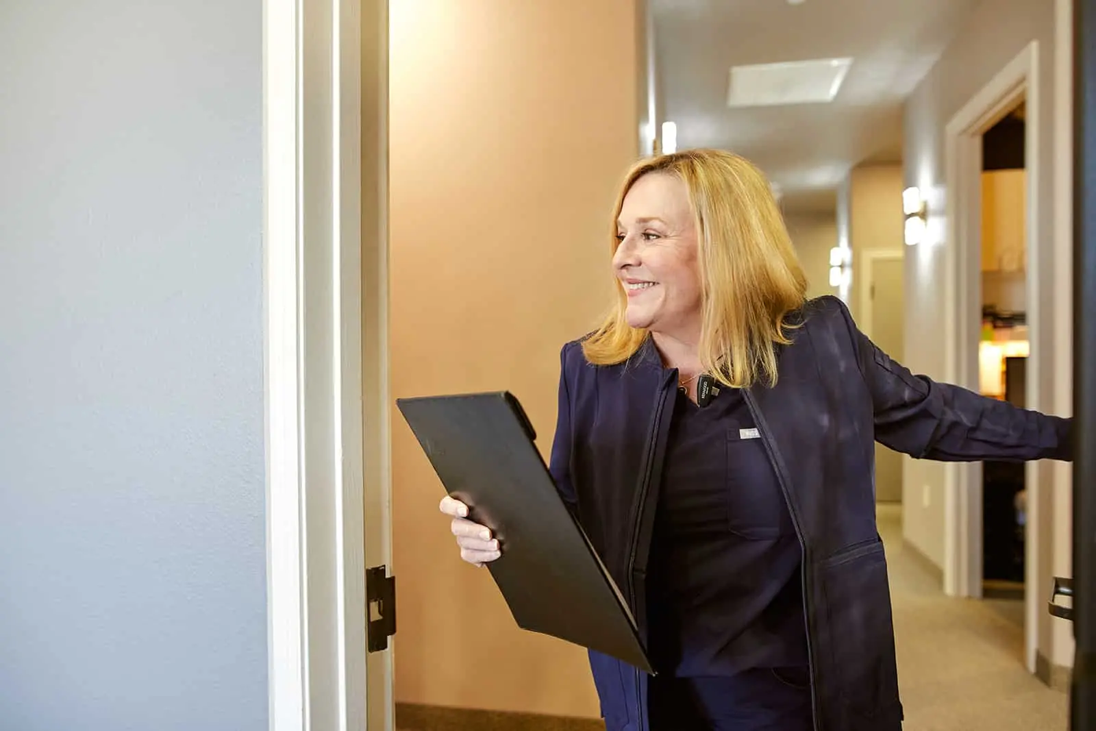 Stonebriar Smile Design team member welcoming a patient in the Frisco office