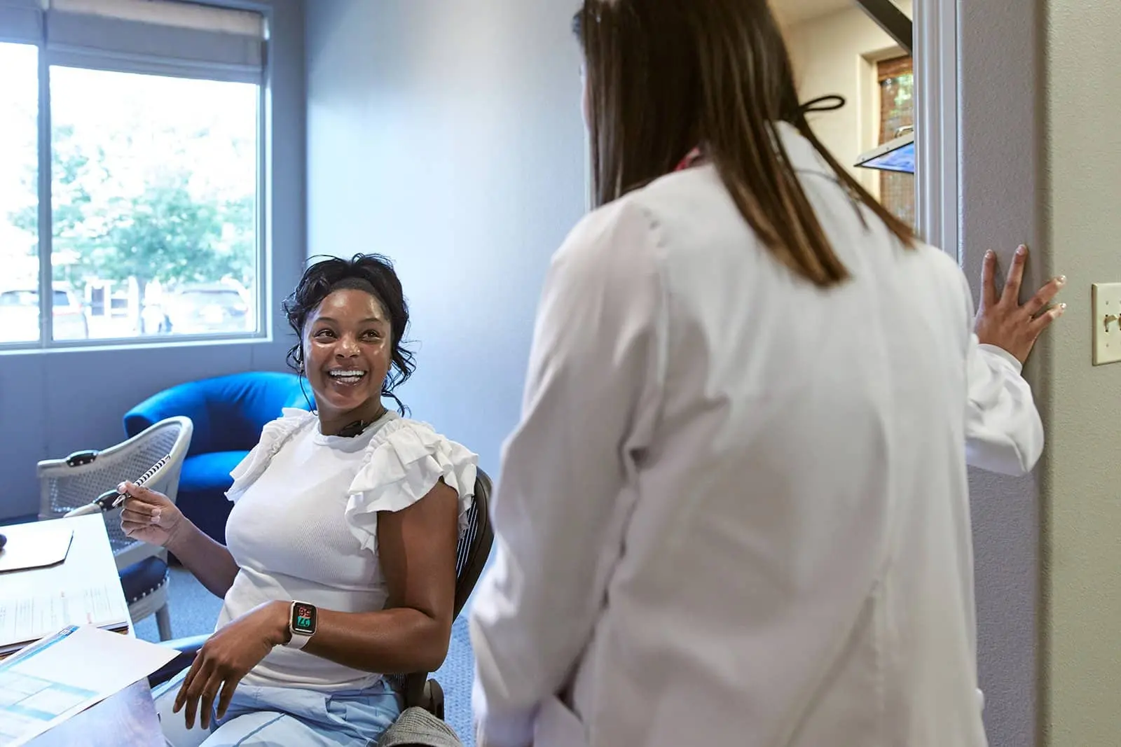 Stonebriar Smile Design clinician caring for a patient in a treatment room