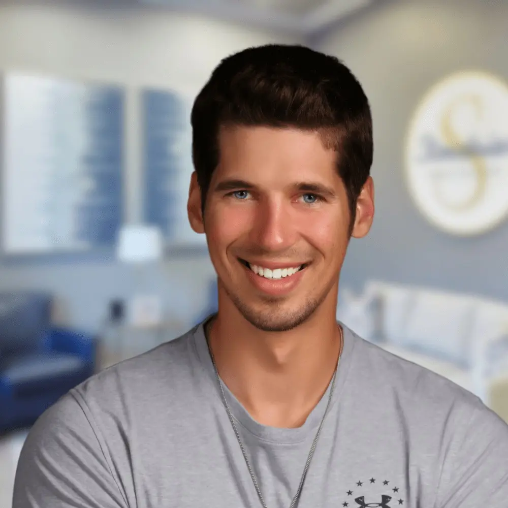 Clear orthodontic aligner fitted over a patient’s teeth
