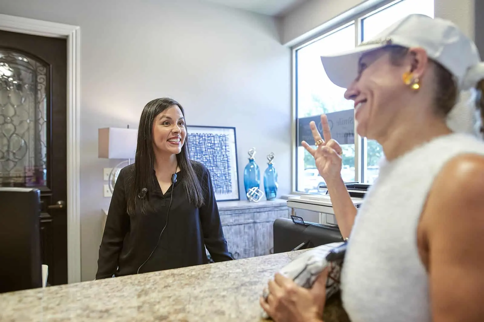 Stonebriar Smile Design team member discussing care in the Frisco office