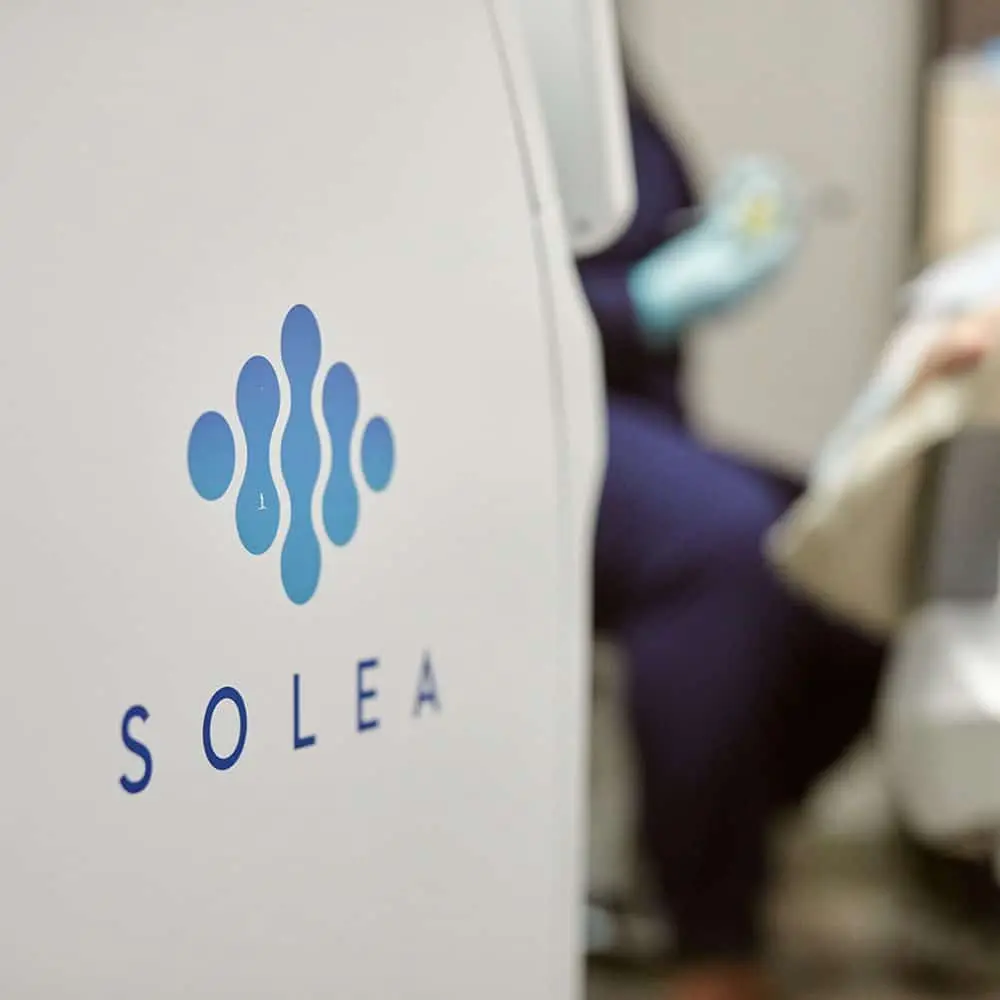Patient receiving comfort-focused dental care with modern laser technology