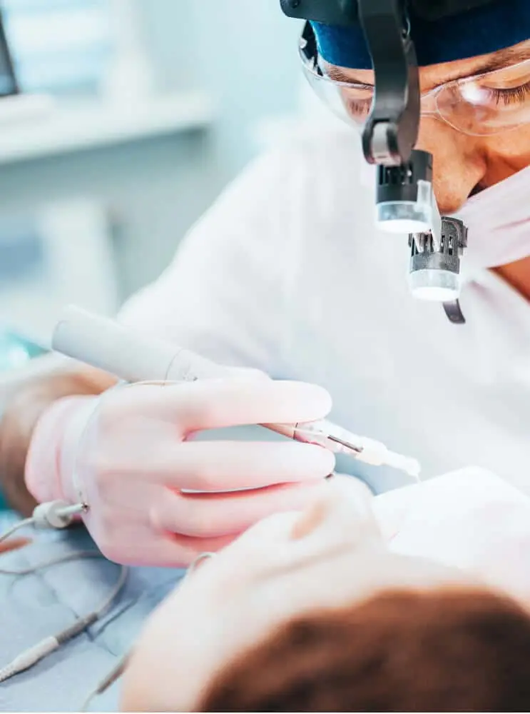 Clinician reviewing treatment information before a dental procedure