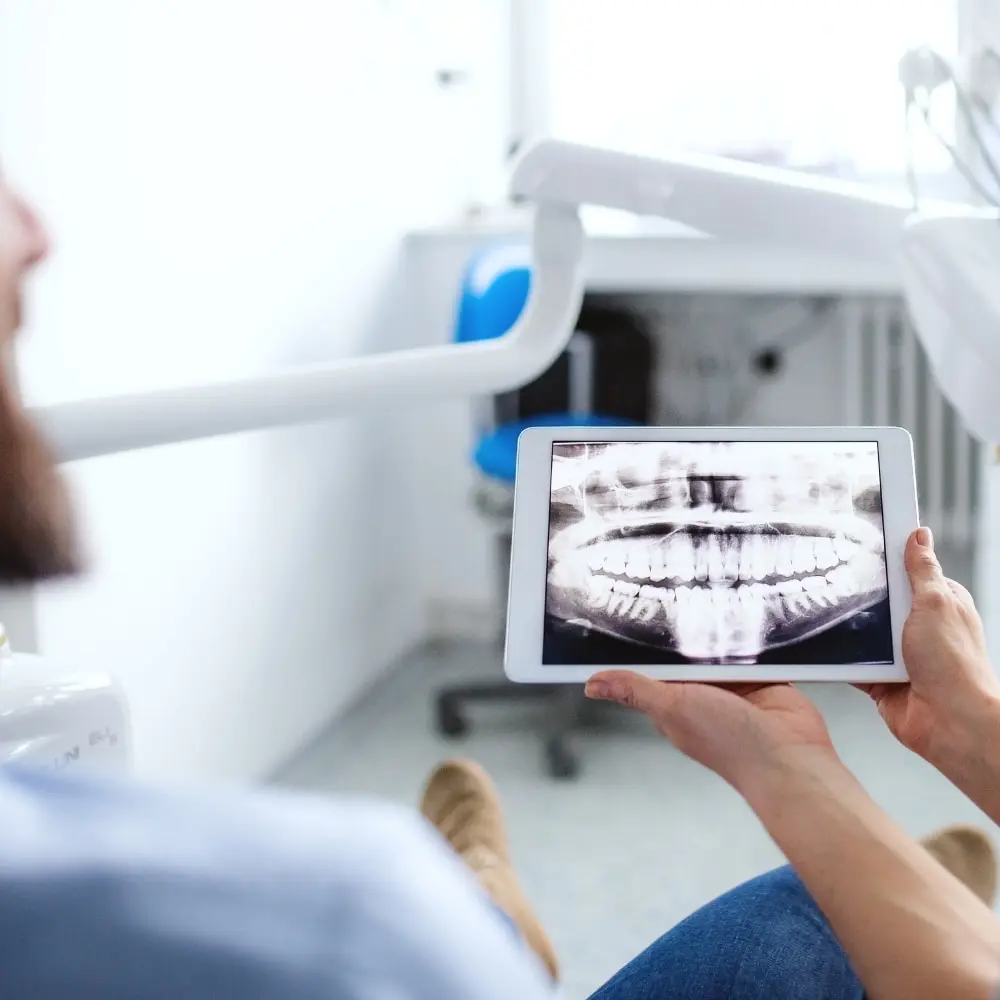 Dentist and patient collaborating on a personalized cosmetic treatment plan