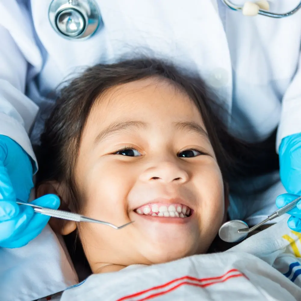 Dentist evaluating gum health during an examination