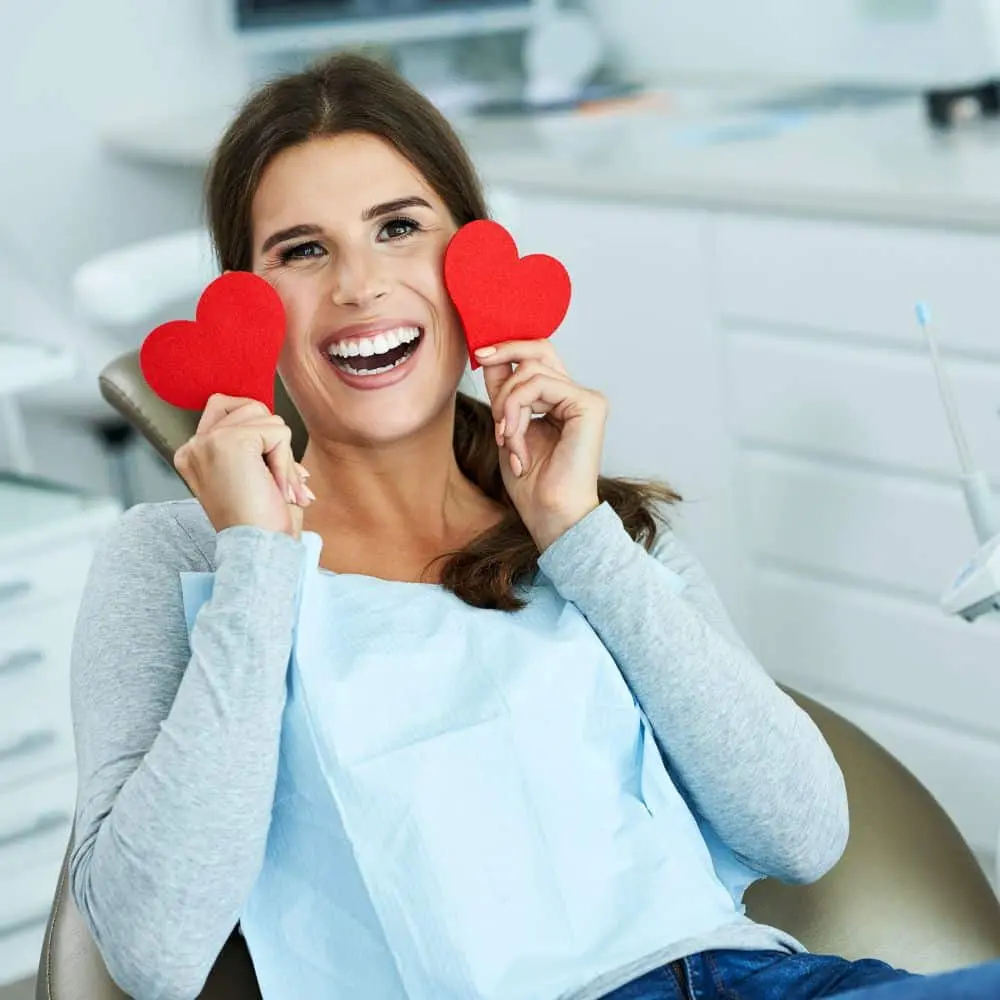 Patient discussing oral and heart health with the Stonebriar dental team