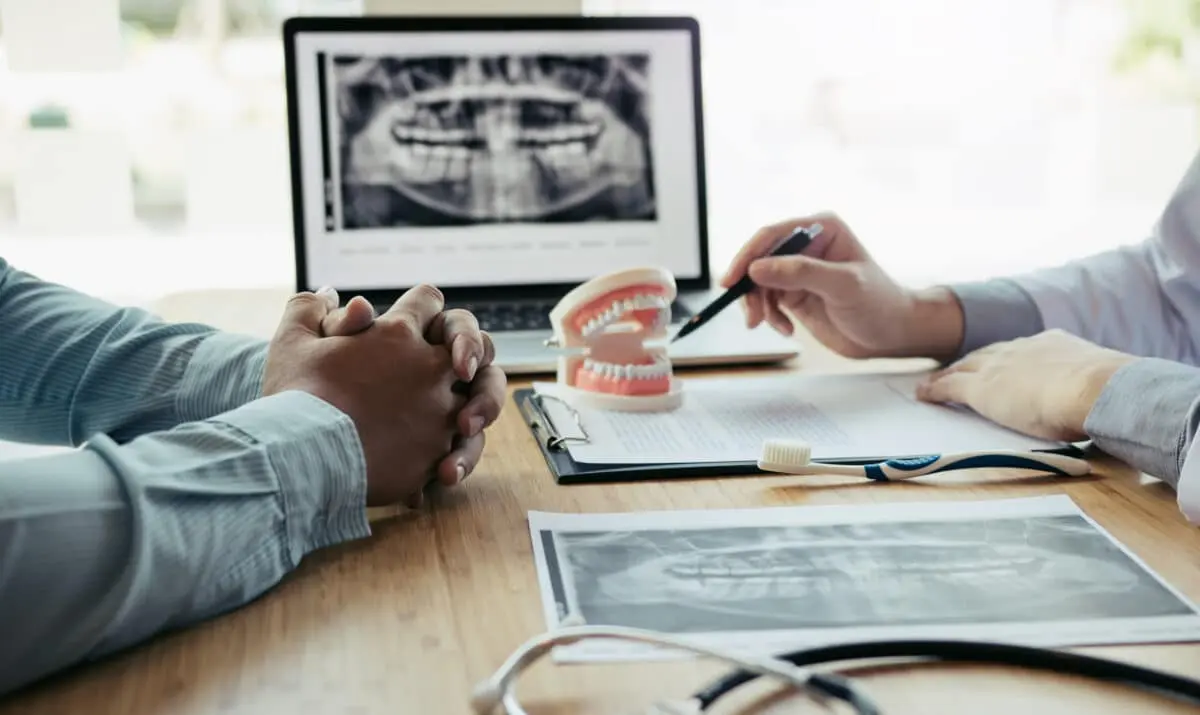Dentist reviewing oral health information with a patient